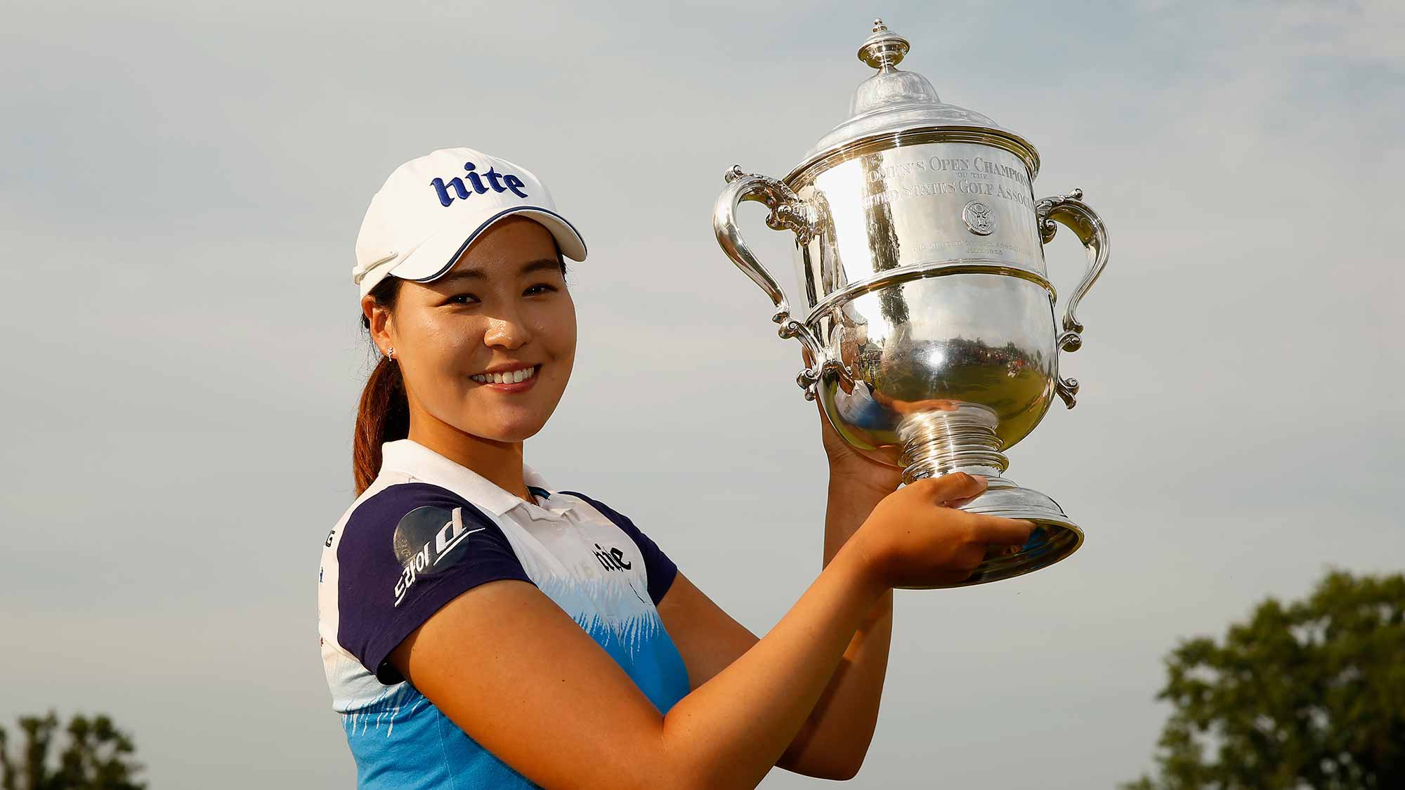 In Gee Chun of South Korea poses with the trophy after winning the U.S. Women's Open at Lancaster Country Club