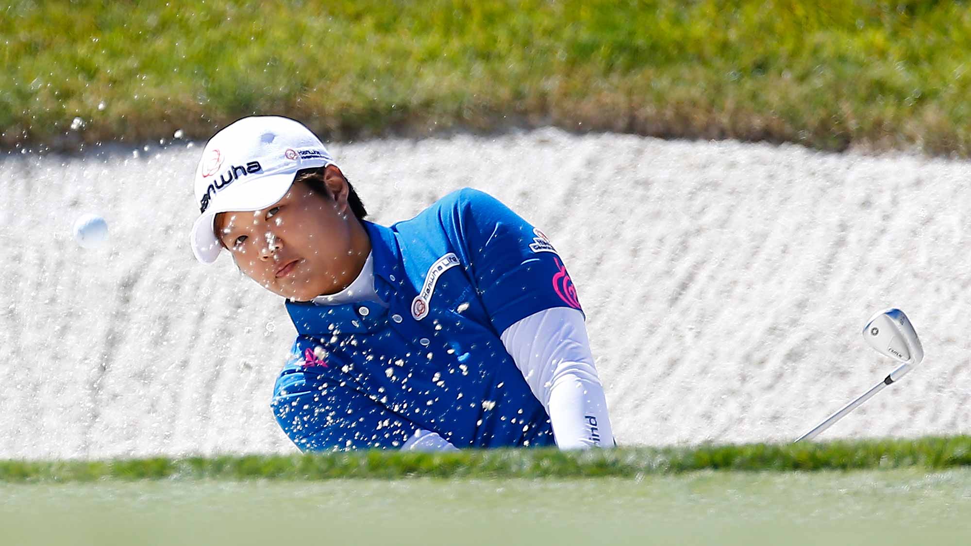 Haru Nomura of Japan hits out of the bunker on the 1st hole during the third round of the U.S. Women's Open at CordeValle Golf Club