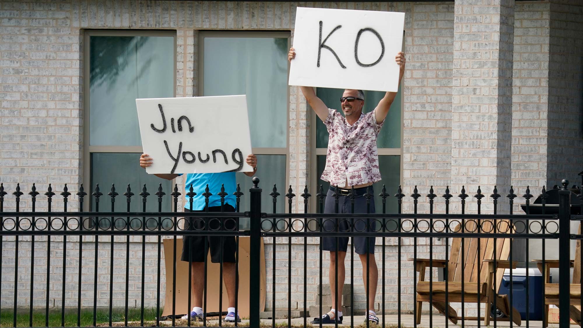 Fans at a home near the second green show their support for Jin Young Ko during the third round of the Volunteers of America Classic 
