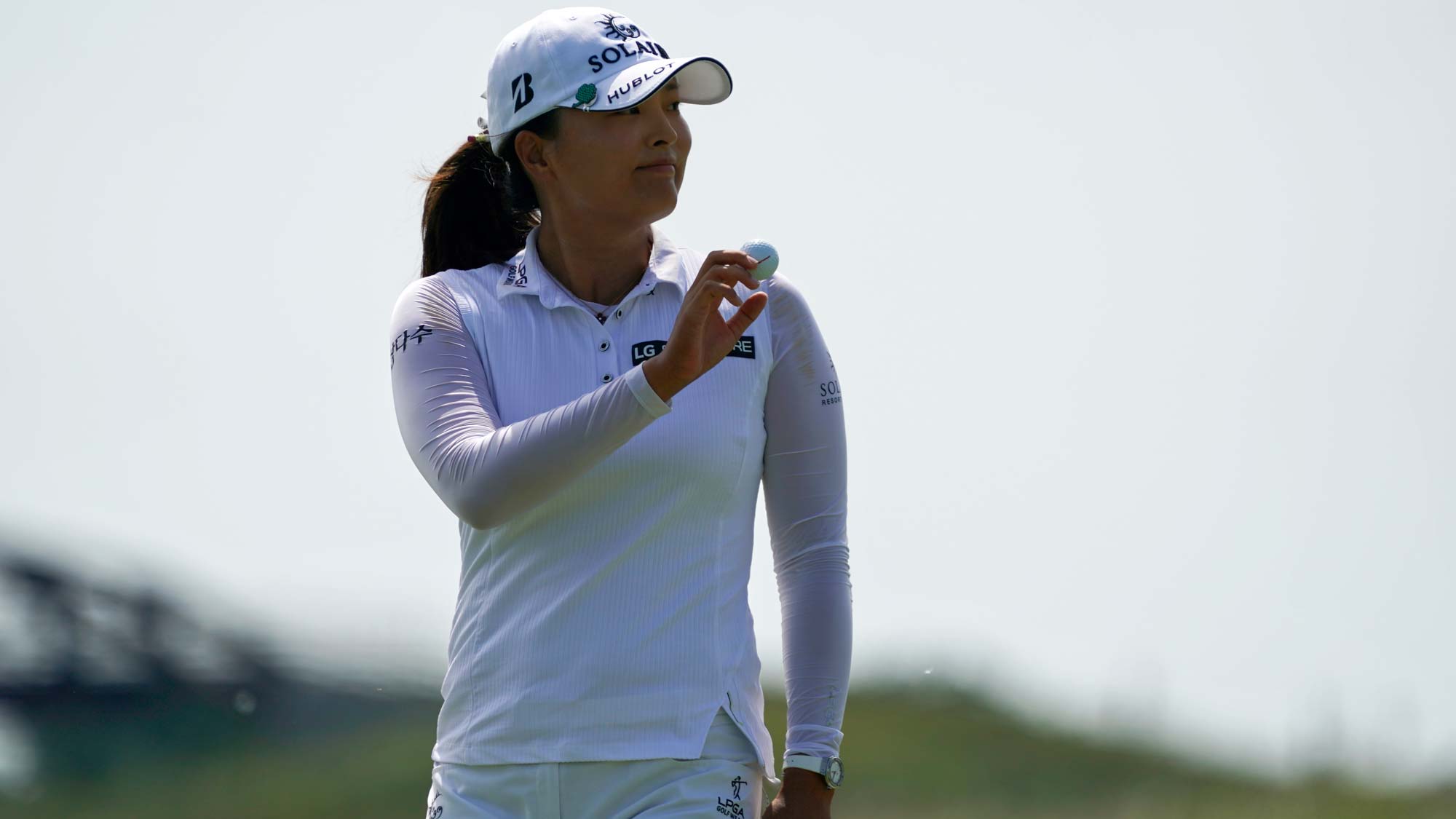 Jin Young Ko of Korea reacts to the crowd after making a putt on the second hole during the third round of the Volunteers of America Classic