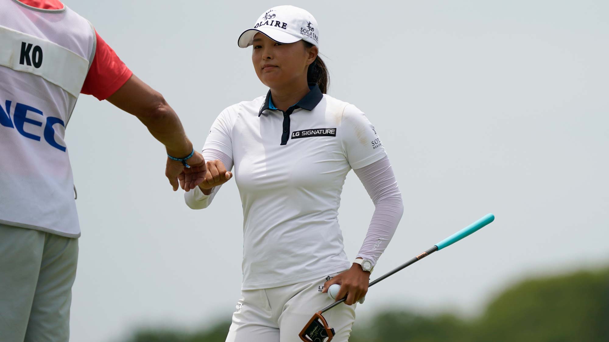 Jin Young Ko of Korea gets a fist bump after her birdie putt on the second hole during the final round of the Volunteers of America Classic