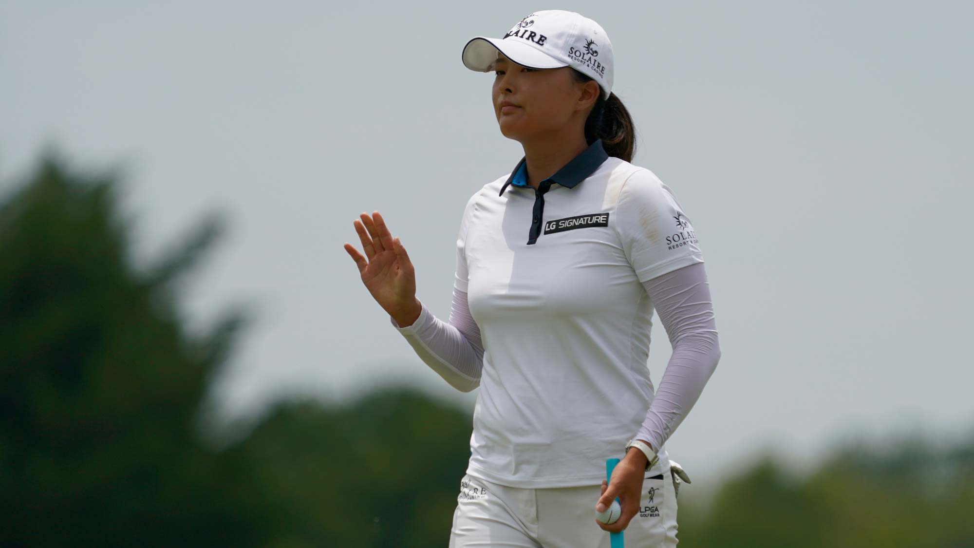 Jin Young Ko of Korea reacts to the crowd after her birdie putt on the second hole during the final round of the Volunteers of America Classic