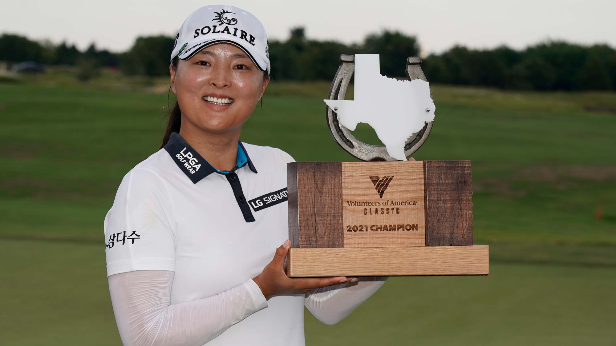 Jin Young Ko of Korea poses with the trophy after winning the Volunteers of America Classic