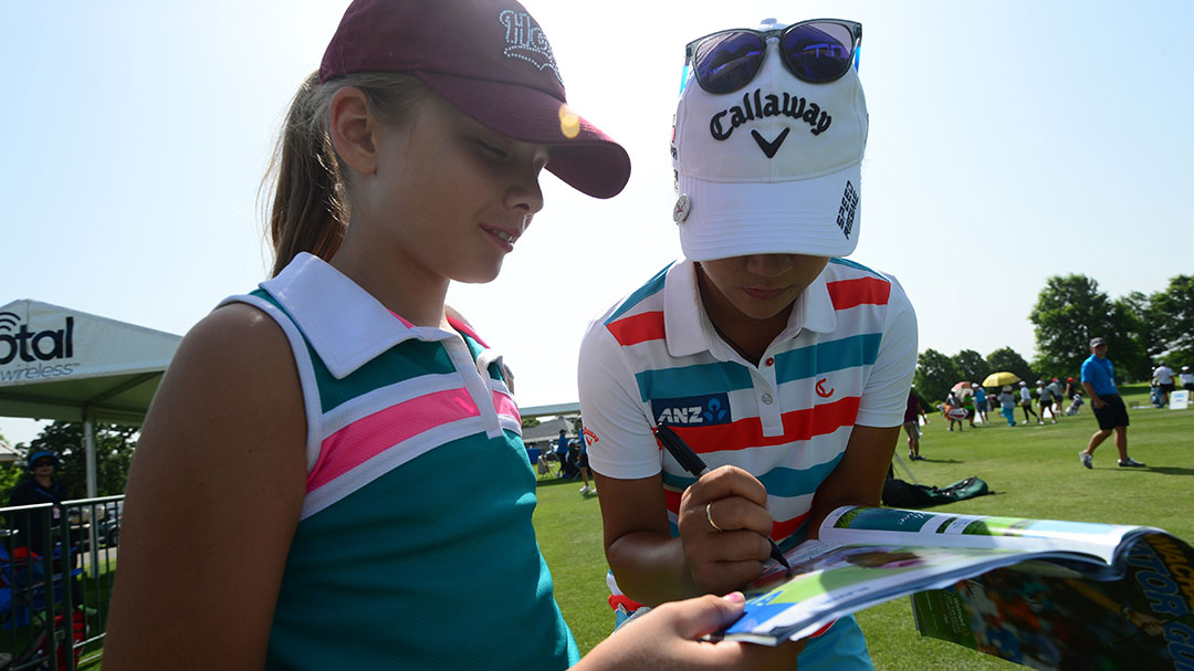 Lydia Ko signing an autograph for a young fan during her Tuesday Practice Round