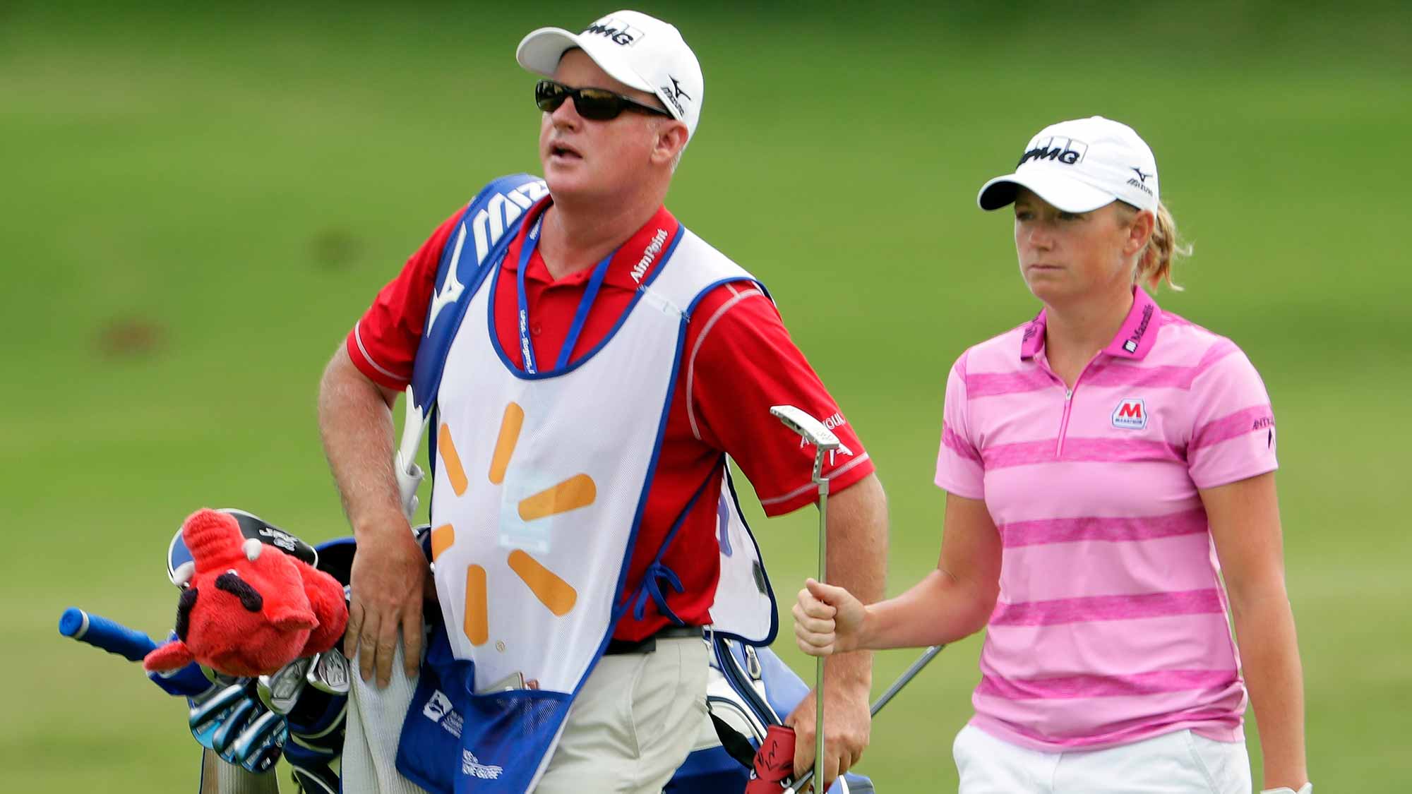 Stacy Lewis walks up the fairway alongside her caddie on the 10th hole during the first round of the Walmart NW Arkansas Championship Presented by P&G