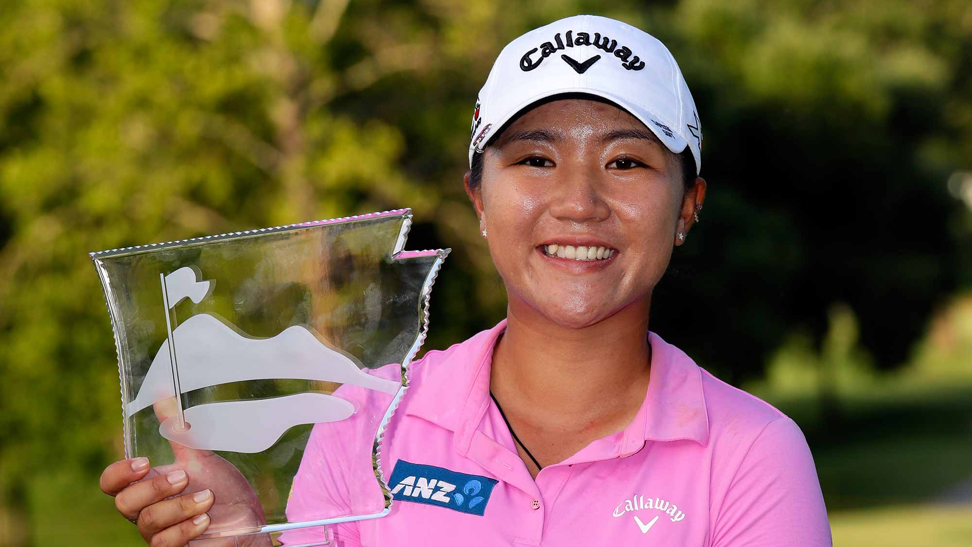 Lydia Ko of New Zealand displays the trophy after winning the Walmart NW Arkansas Championship