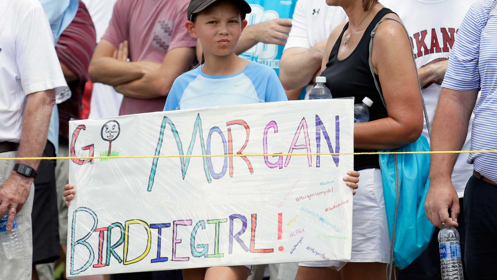 A young fan hold a sign in support of Morgan Pressel of the United States during the final round of the Walmart NW Arkansas Championship