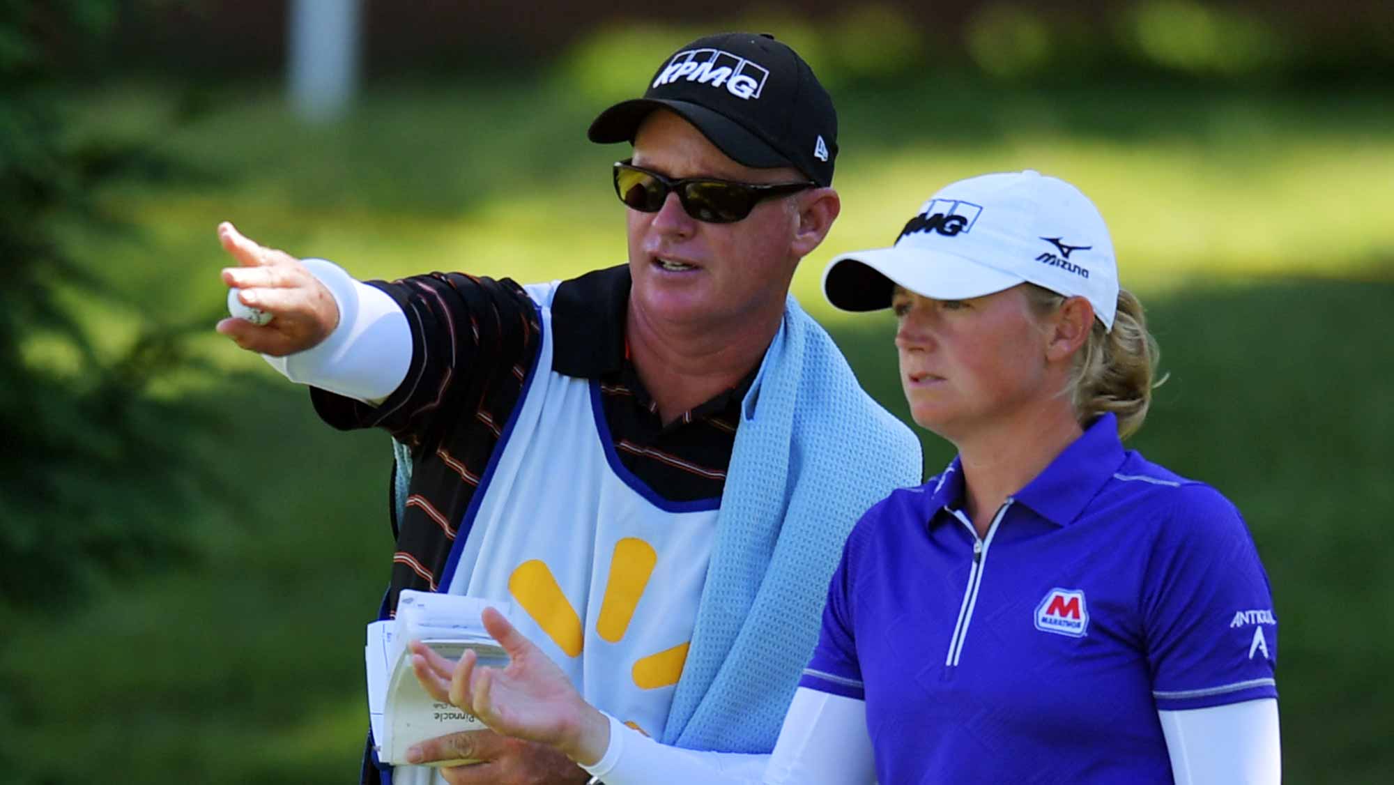 Stacy Lewis consults with her caddie on the 14th hole during the second round of the Walmart NW Arkansas Championship Presented by P&G 