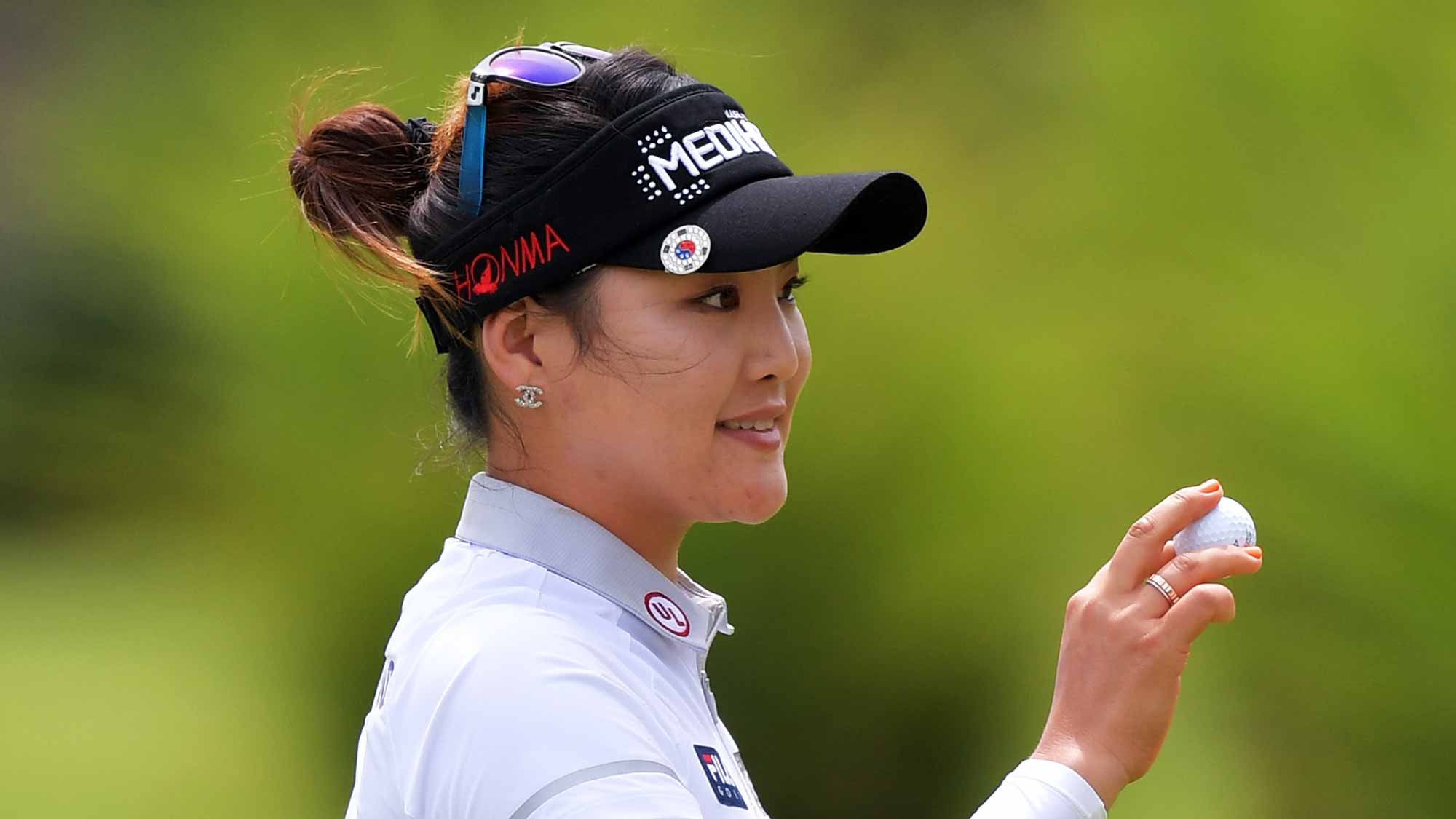 So Yeon Ryu of Korea waves her ball to the crowd after a birdie on the first hole during the second round of the Walmart NW Arkansas Championship Presented by P&G 