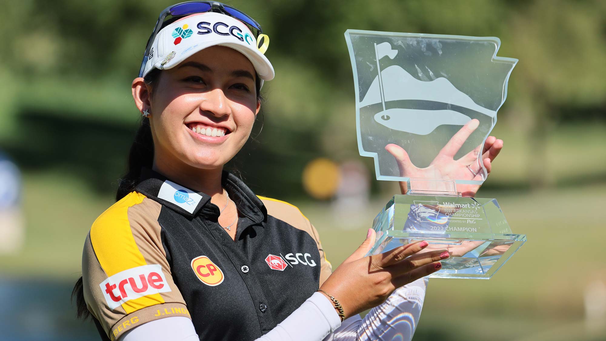 Atthaya Thitikul of Thailand holds the winner's trophy after winning the Walmart NW Arkansas Championship Presented by P&G