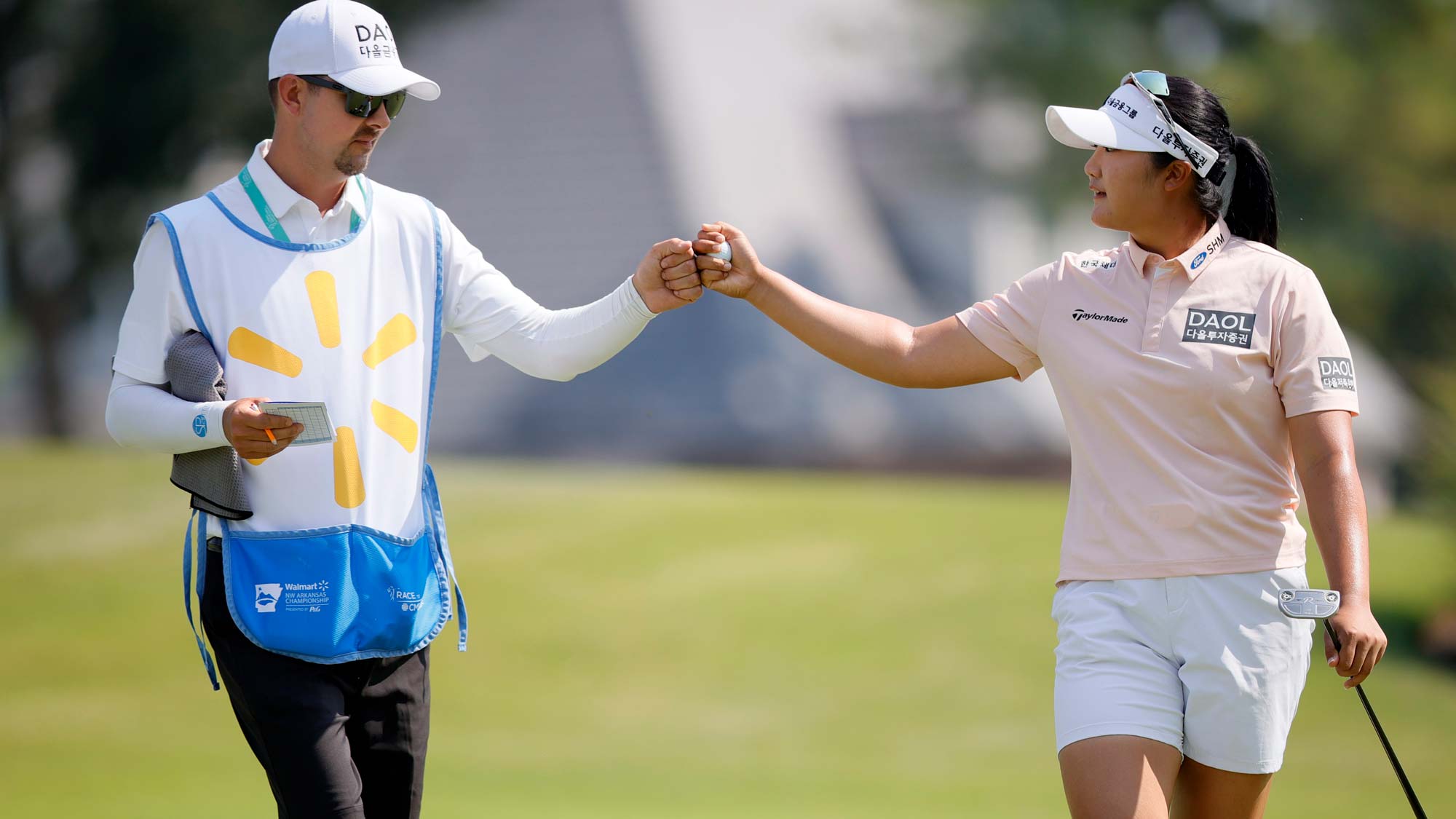 Hae Ran Ryu of South Korea reacts to her birdie putt with her caddie on the first green during the Final round of the Walmart NW Arkansas Championship presented by P&G at Pinnacle Country Club