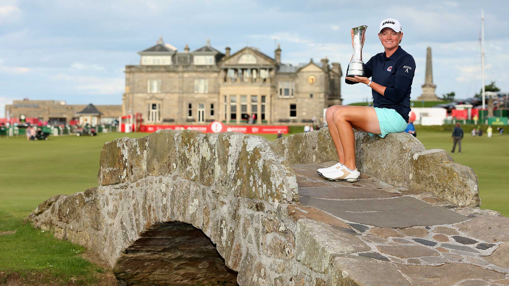 Stacy Lewis of the United States poses with the trophy on the Swilcan Bridge following her victory during the final round of the Ricoh Women's British Open at the Old Course, St Andrews on August 4, 2013 in St Andrews, Scotland.