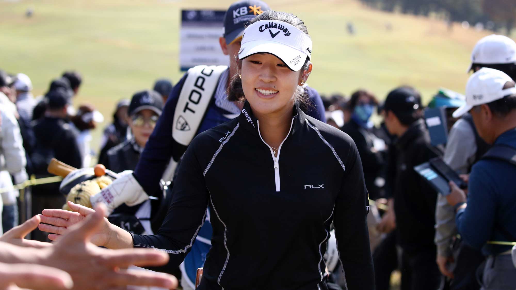 Andrea Lee of the United States interacts with fans during the final round of the BMW Ladies Championship