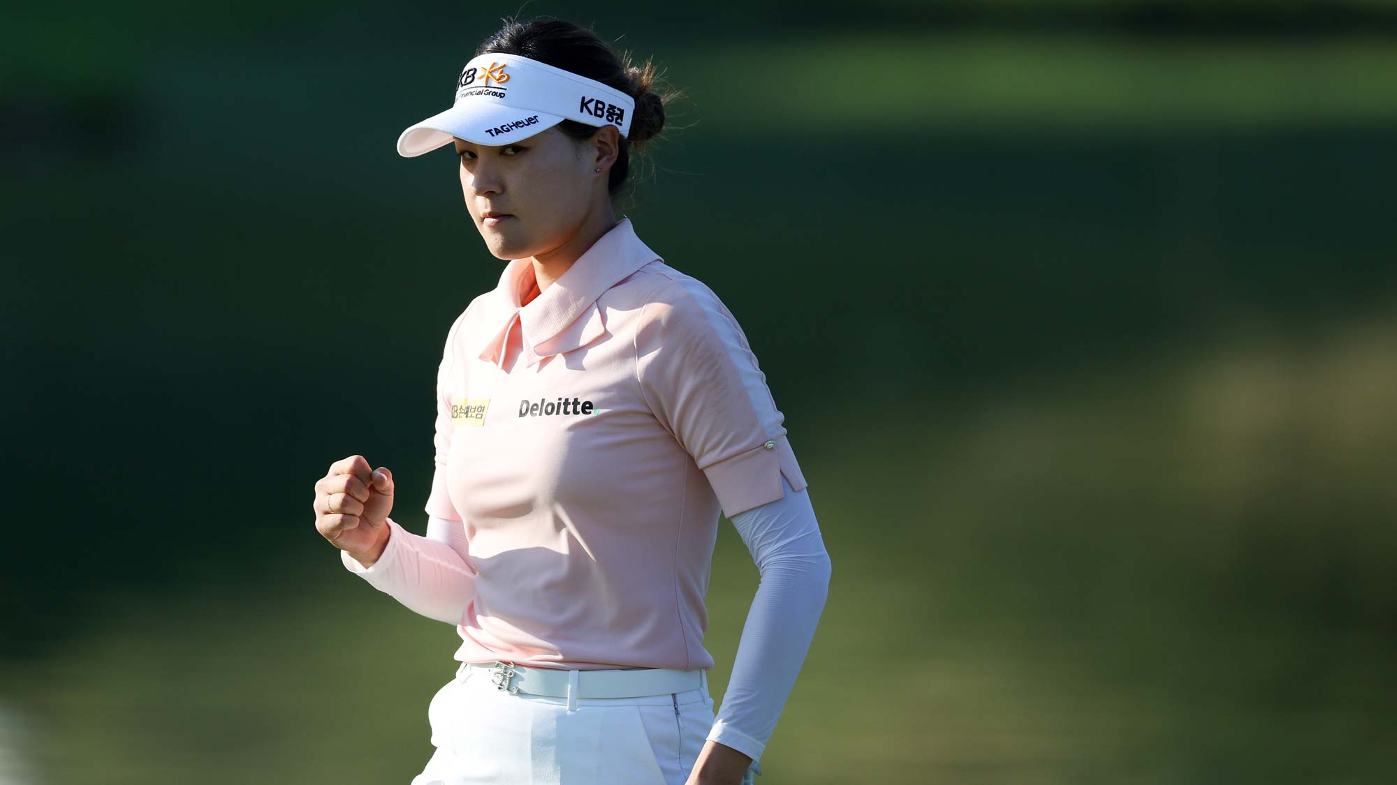 In Gee Chun of South Korea waves after putting out on the 18th greenduring the second round of the KPMG Women's PGA Championship at Congressional Country Club
