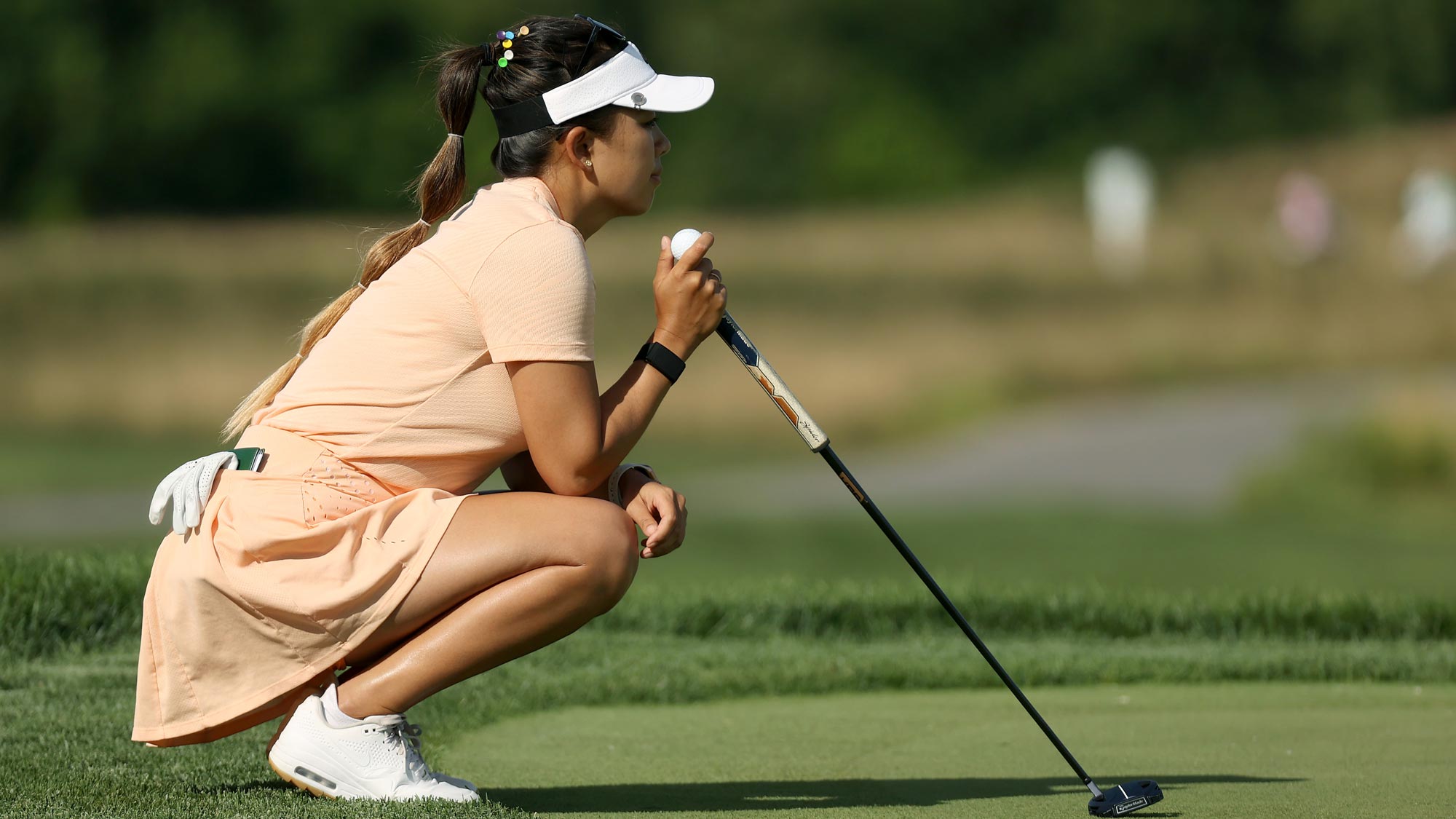 Brianna Do lines up a putt on the fifth green during the first round of the LPGA Drive On Championship