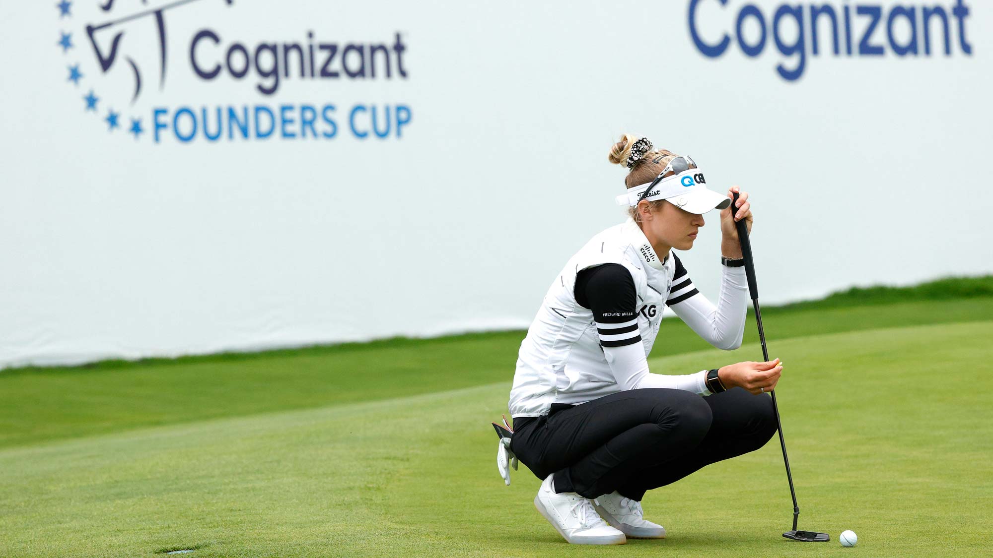 Nelly Korda of the United States lines up her shot on the 18th green during the third round of the Cognizant Founders Cup