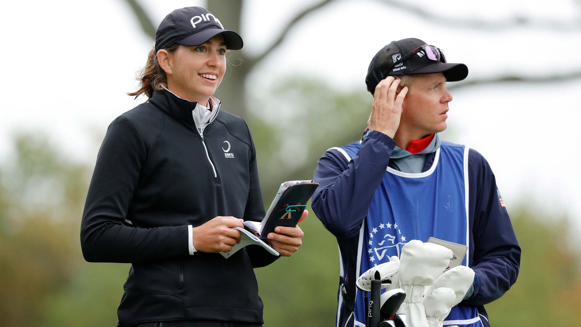 Elizabeth Szokol of the United States talks with her caddie before hitting her tee shot on the 2nd hole during the final round of the Cognizant Founders Cup