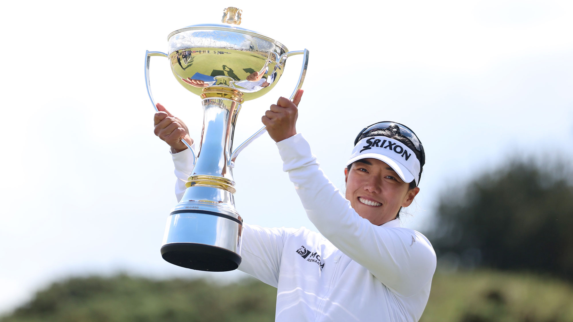 Jenny Shin of South Korea hoists the trophy after winning the ISPS HANDA Women's Scottish Open 2026 at Dundonald Links Golf Course on July 26, 2026 in Troon, Scotland.