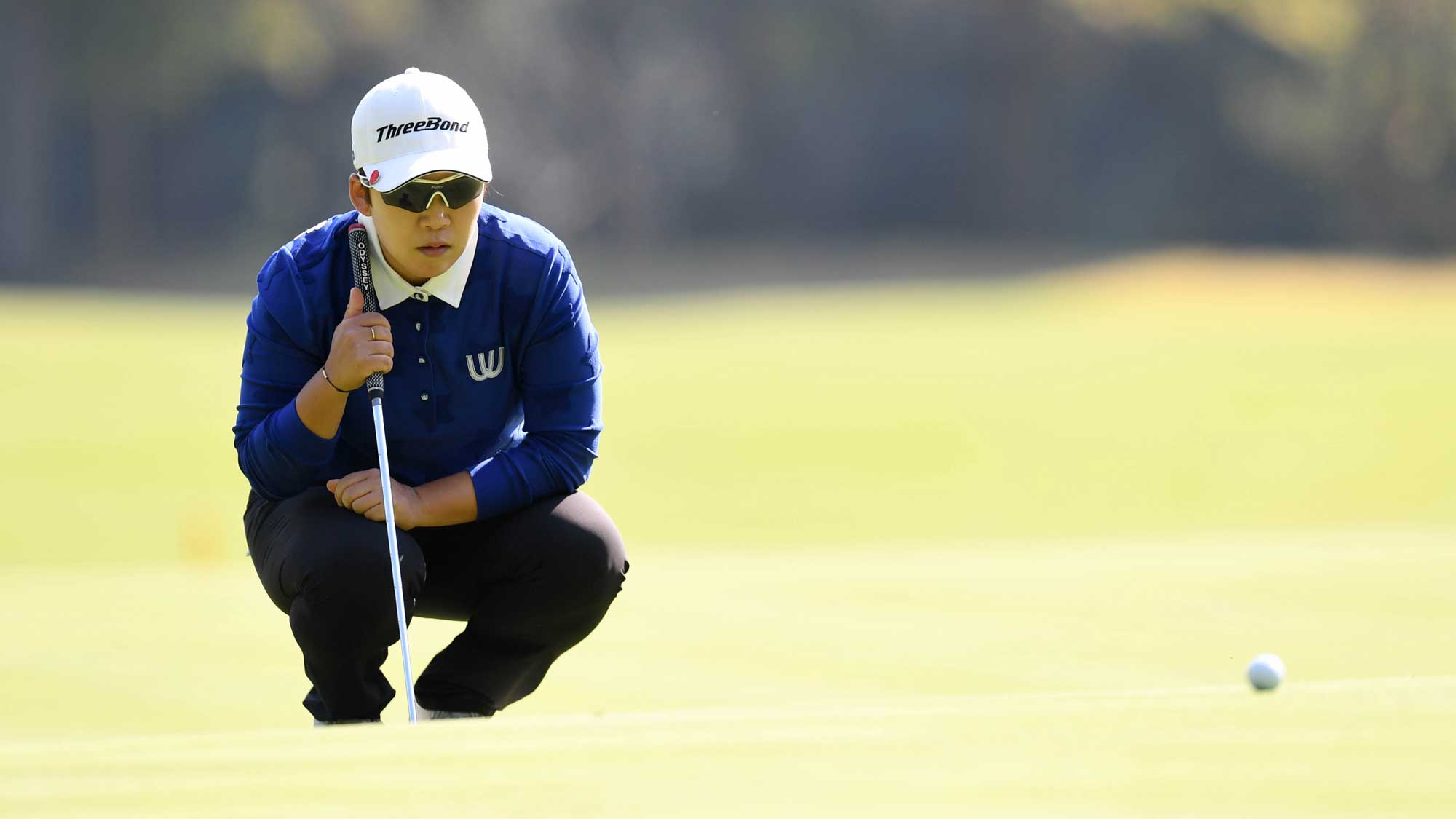 Jiyai Shin of South Korea lines up her putt on the 6th hole during the final round of the TOTO Japan Classic