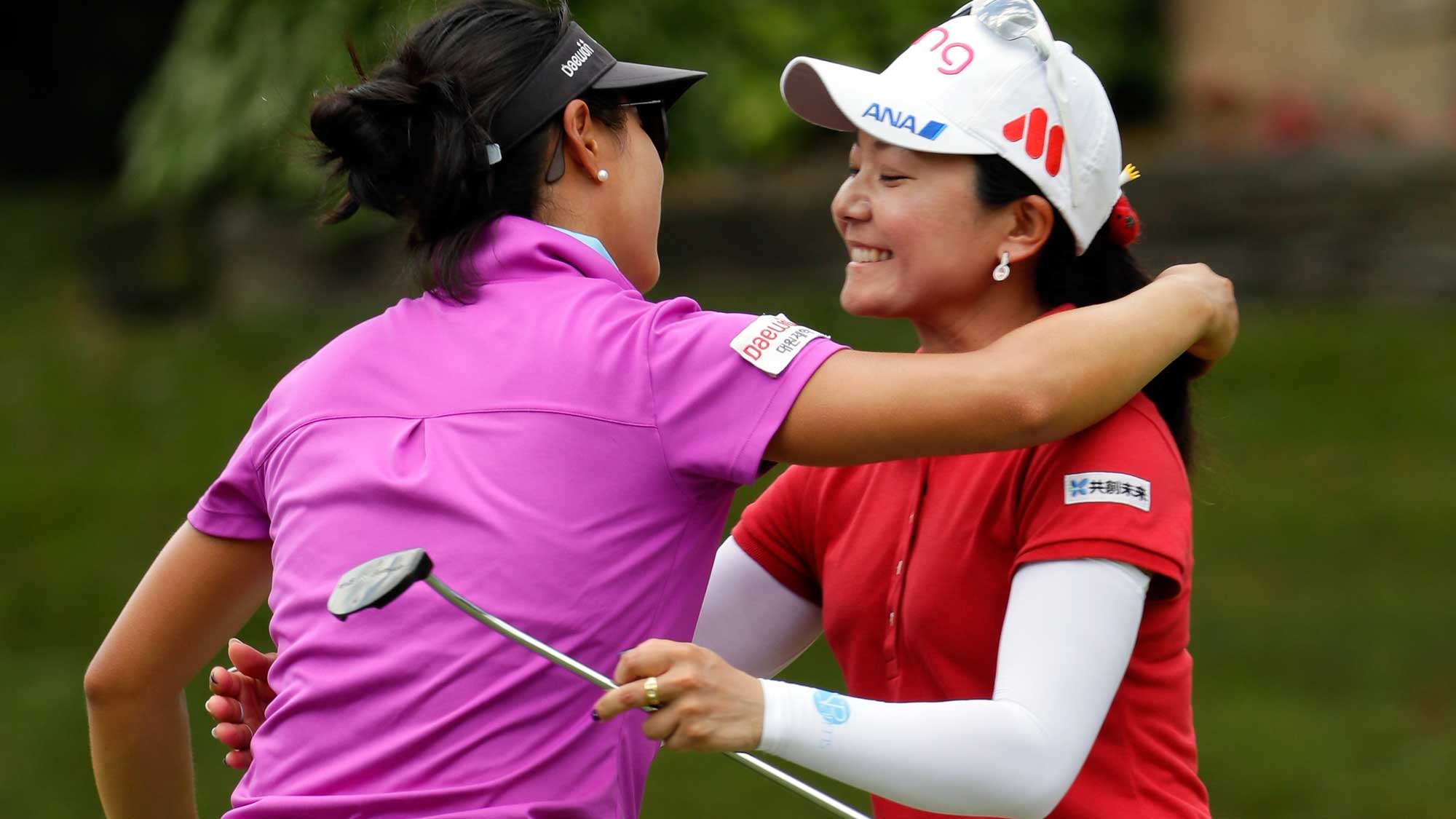 Ayako Uehara of Japan hugs Kelly W Shon on the 9th hole after their round during the first round of the Walmart NW Arkansas Championship