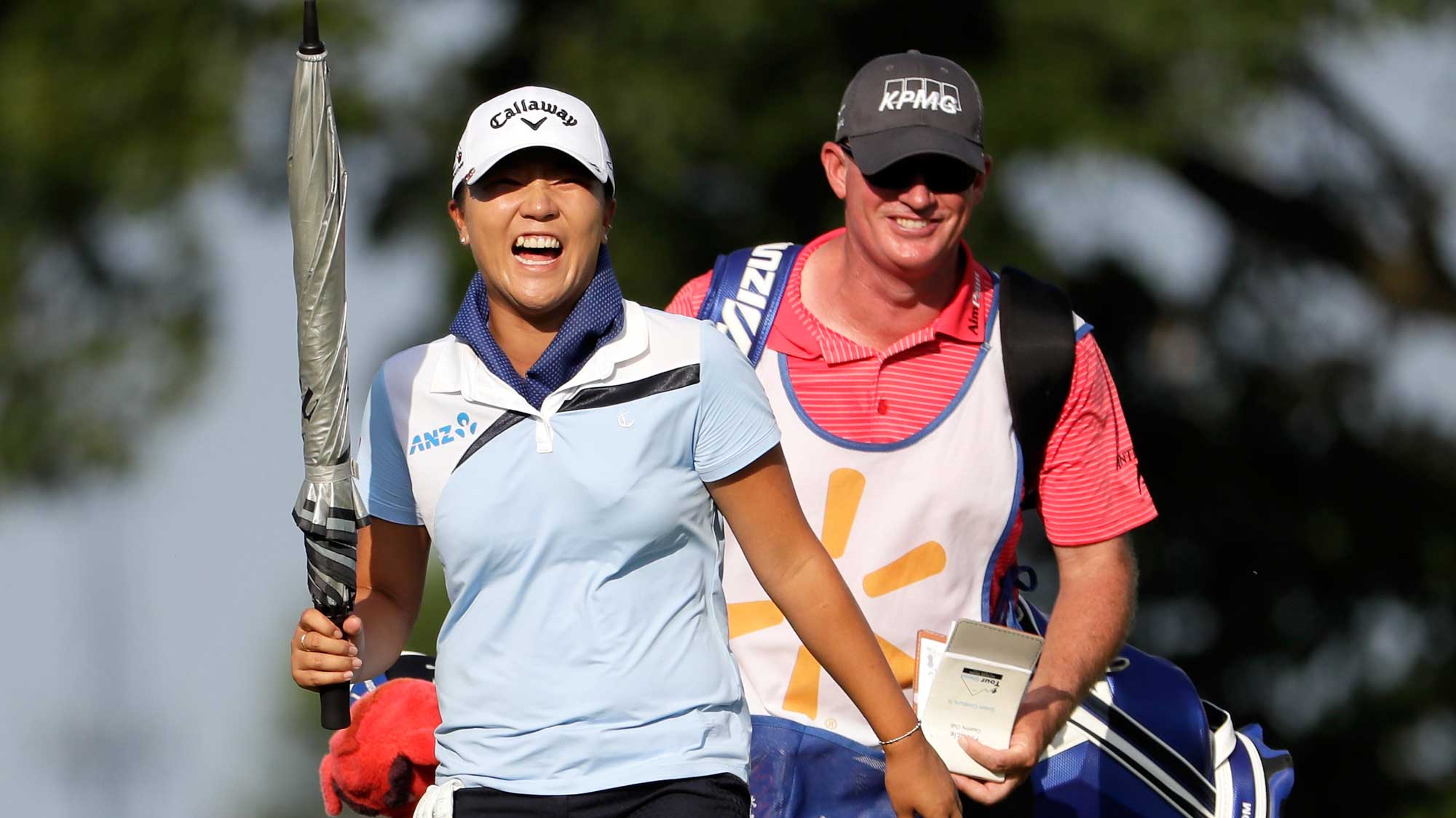 Lydia Ko of New Zealand jokes while she walks up the fairway on the 18th hole during the second round of the Walmart NW Arkansas Championship